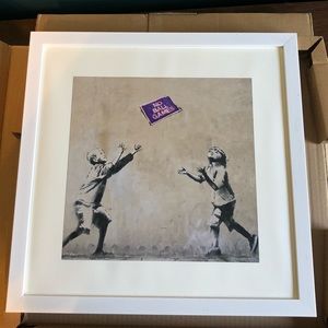 Set of three framed Banksy prints
